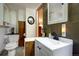 Guest bathroom with a vanity and toilet at 5673 Santa Clara Rd, Indian Hills, CO 80454