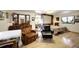 Comfortable bedroom with a murphy bed and sitting area at 5673 Santa Clara Rd, Indian Hills, CO 80454