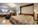 Main bedroom with a murphy bed and hardwood floors at 5673 Santa Clara Rd, Indian Hills, CO 80454