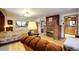 Bright bedroom with a queen bed and access to the bathroom at 5673 Santa Clara Rd, Indian Hills, CO 80454