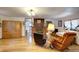 Spacious living room with hardwood floors and built-in storage at 5673 Santa Clara Rd, Indian Hills, CO 80454