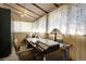 Home office with a desk and built-in shelving at 5673 Santa Clara Rd, Indian Hills, CO 80454