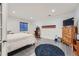 Basement bedroom with a dresser, a full bed, and a fun arcade game at 12043 Fontberry St, Parker, CO 80134
