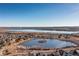 Aerial view of neighborhood by a lake at 9821 S Flower Ct, Littleton, CO 80127