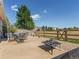 Relaxing backyard patio with fire pit and outdoor dining area at 5647 Raleigh Cir, Castle Rock, CO 80104