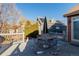 Backyard patio with table, chairs, and umbrella at 12955 Vallejo Cir, Westminster, CO 80234