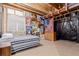Unfinished basement bedroom with a single bed at 12955 Vallejo Cir, Westminster, CO 80234