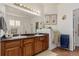 Elegant bathroom with double sinks, a large mirror, and a walk-in shower at 12955 Vallejo Cir, Westminster, CO 80234
