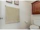 Small bathroom with toilet and wall-mounted cabinet at 12955 Vallejo Cir, Westminster, CO 80234