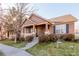 Two-story home with a covered porch and landscaping at 12955 Vallejo Cir, Westminster, CO 80234