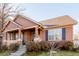 House exterior with a covered porch and stone accents at 12955 Vallejo Cir, Westminster, CO 80234