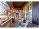 Relaxing front porch with rocking chairs and a swing at 12955 Vallejo Cir, Westminster, CO 80234