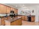 Modern kitchen with an island and stainless steel appliances at 12955 Vallejo Cir, Westminster, CO 80234