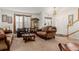 Spacious living room with leather sofas and high ceiling at 12955 Vallejo Cir, Westminster, CO 80234