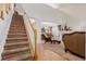 Staircase leading to the upper level with view of living room at 12955 Vallejo Cir, Westminster, CO 80234
