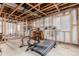 Unfinished basement with a treadmill and weights at 12955 Vallejo Cir, Westminster, CO 80234