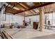 Unfinished basement with storage and exercise equipment at 12955 Vallejo Cir, Westminster, CO 80234