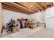 Unfinished basement with various storage items at 12955 Vallejo Cir, Westminster, CO 80234