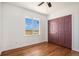 Simple bedroom with hardwood floors and window views at 3647 County Road 19, Fort Lupton, CO 80621