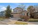 Two-story house with attached garage and landscaping at 11667 Pink Phlox Dr, Parker, CO 80134