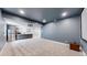 Finished basement with wet bar and media area at 1061 Equinox Ln, Erie, CO 80516