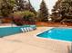 Community pool with surrounding patio and seating at 8318 W 90Th Ave, Broomfield, CO 80021