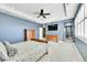 Main bedroom with TV and large windows at 14672 Melco Ave, Parker, CO 80134
