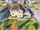 Aerial view showcasing a house with a solar panel system, a large backyard, and patio area at 14672 Melco Ave, Parker, CO 80134