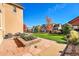 Landscaped backyard with patio and grassy area at 14672 Melco Ave, Parker, CO 80134