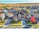 Aerial view of a house in a residential neighborhood with beautiful landscaping and fall colors at 14672 Melco Ave, Parker, CO 80134