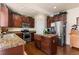 Spacious kitchen with granite countertops, stainless steel appliances, and an island at 8104 El Jebel Loop, Castle Rock, CO 80108