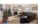 Bright living room with a fireplace and two Christmas trees at 8104 El Jebel Loop, Castle Rock, CO 80108