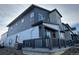 Gray siding and stone accents characterize this two-story home at 14555 W 91St Ave # A, Arvada, CO 80005