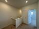 Upstairs hallway with access to bedrooms and bathroom at 14555 W 91St Ave # A, Arvada, CO 80005