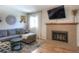 Spacious living room featuring a fireplace and hardwood floors at 11597 N Settlers Dr, Parker, CO 80138