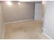 Finished basement area with neutral walls and carpeting at 1350 N Ulster St, Denver, CO 80220