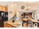 Kitchen with dining area, granite countertops, and view of the living room at 1058 Mulberry Ln, Highlands Ranch, CO 80129