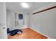 Hardwood floor bedroom with window and closet at 6103 Uno St, Arvada, CO 80003