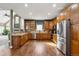 Eat-in kitchen with stainless steel appliances and hardwood floors at 29850 E 167Th Pl, Brighton, CO 80603