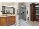 Bathroom with walk-in shower and built-in shelving at 29850 E 167Th Pl, Brighton, CO 80603