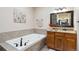 Bathroom with soaking tub and granite countertop at 29850 E 167Th Pl, Brighton, CO 80603