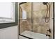 Bathroom with a shower/tub combo and neutral-toned tile at 29850 E 167Th Pl, Brighton, CO 80603