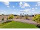 Spacious backyard with a white fence and a view of a barn at 29850 E 167Th Pl, Brighton, CO 80603