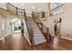 Grand entryway with a stunning staircase, hardwood floors, and high ceilings at 29850 E 167Th Pl, Brighton, CO 80603