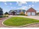 Brick and shingle house with a two car garage at 29850 E 167Th Pl, Brighton, CO 80603