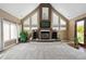 Large living room with a stunning fireplace, high ceilings, and lots of natural light at 29850 E 167Th Pl, Brighton, CO 80603