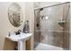 Bathroom with walk-in shower and pedestal sink at 29850 E 167Th Pl, Brighton, CO 80603