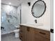 Modern bathroom with a walk-in shower and floating vanity at 2200 Newton St, Denver, CO 80211