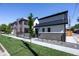 Two story home with brick facade and attached garage at 2200 Newton St, Denver, CO 80211