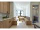 Built-in kitchen nook with a window seat and a small round table at 2200 Newton St, Denver, CO 80211